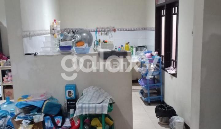 tampak depan rumah babatan pratama dekat ke