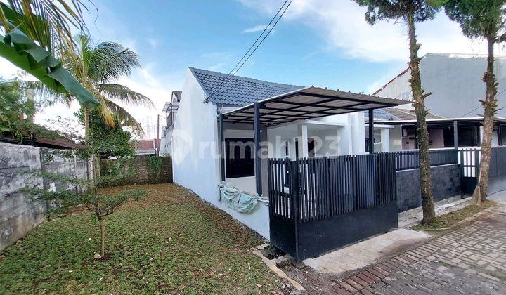 tampak depan rumah hoek murah siap huni