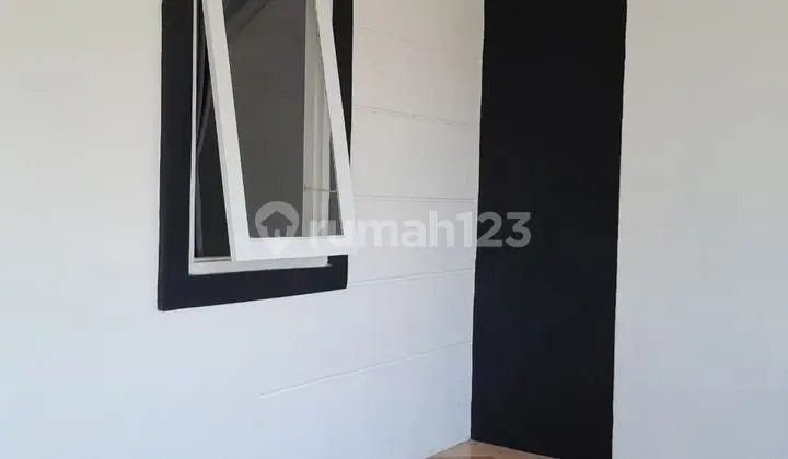 tampak depan rumah dijual di perumahan bukit