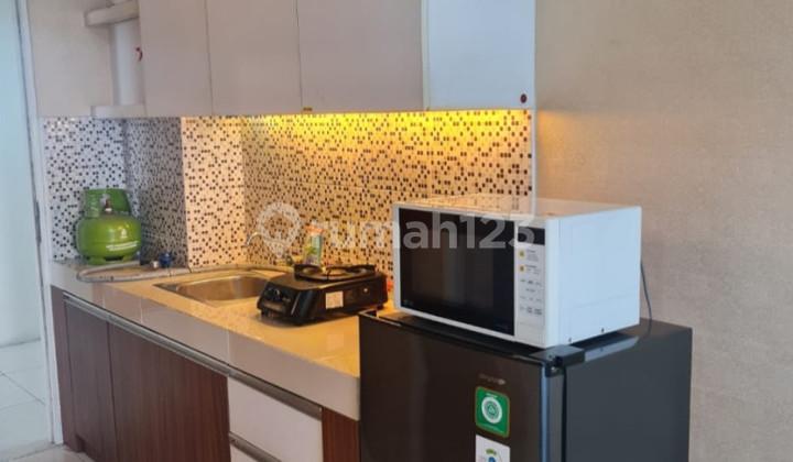 tampak depan apartemen view golf full furnish