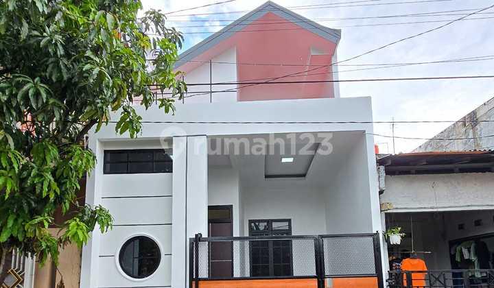 tampak depan rumah siap huni type mezaninne