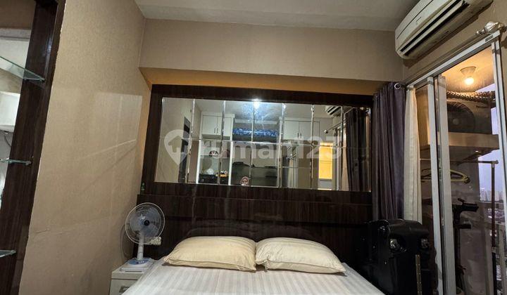 kamar tidur apartemen taman melati full furnish