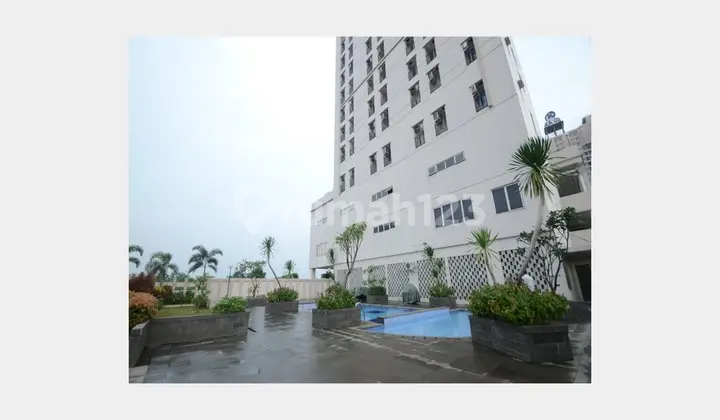 tampak depan apartemen termurah siap huni area