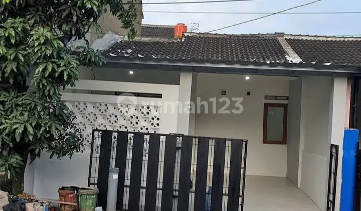 tampak depan rumah siap huni di komplek