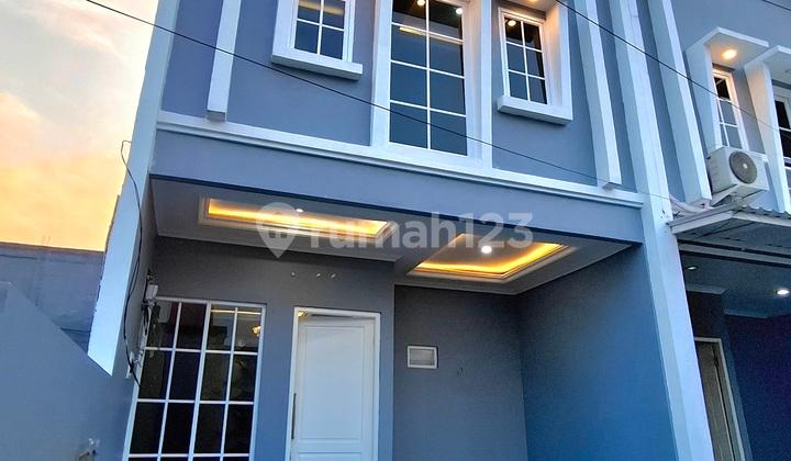 tampak depan rumah murah 2 lantai di