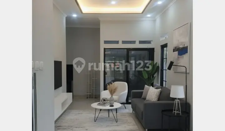 ruang keluarga rumah carport 2 mobil nempel