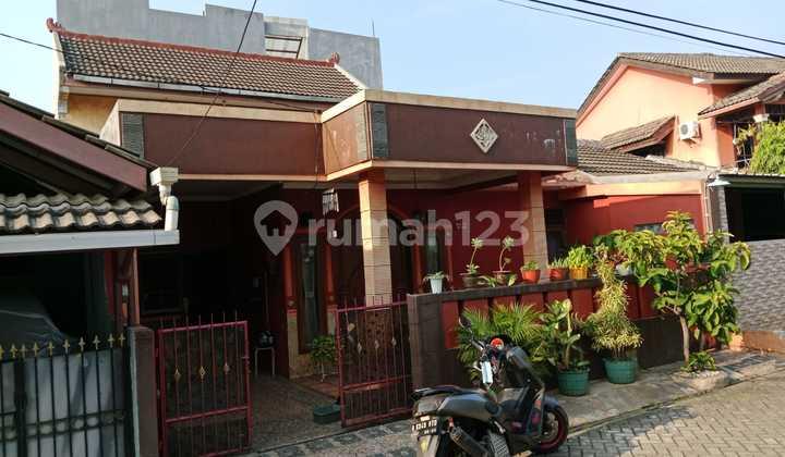 tampak depan rumah komplek pinang griya permai