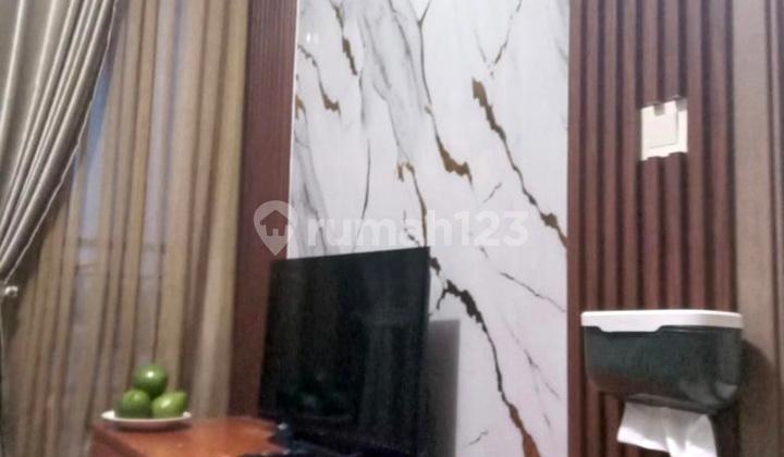 ruang keluarga apartemen podomoro golf view cimanggis