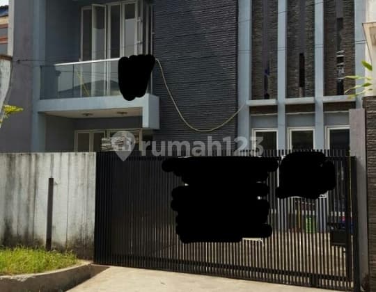 2-story minimalist house with green garden