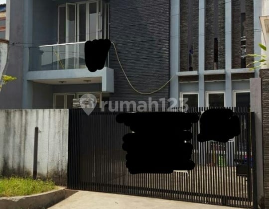 2-story minimalist house with green garden