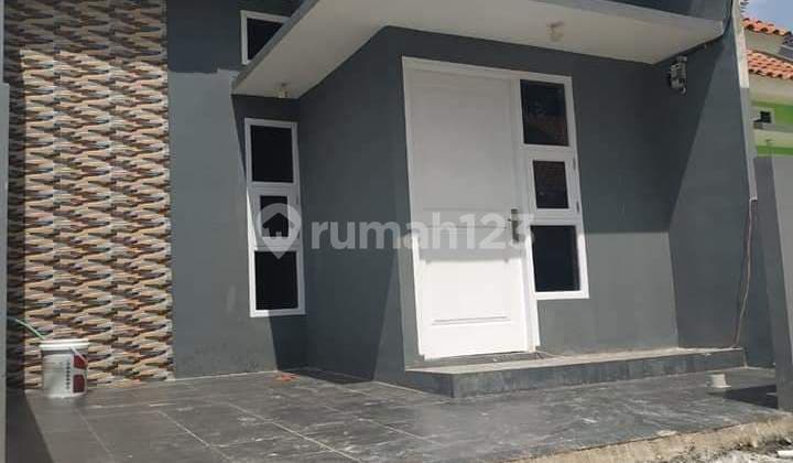 Rumah cluster anti banjir jalan lebar