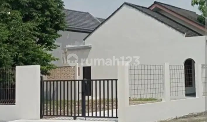 An 18 Dijual Rumah Cantik Dua Kavling di Perumahan Karang Tengah