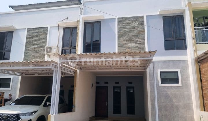 Translation to en: For Rent: Flood-Free Two-Story House in Cluster Kiana Rawalumbu Bekasi