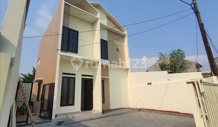 JUAL RUMAH MINIMALIS MODERN 2LT LOKASI STRATEGIS BEBAS BANJIR