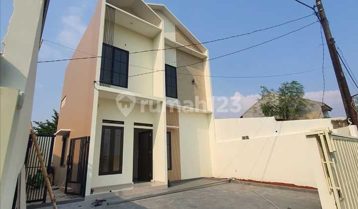 JUAL RUMAH MINIMALIS MODERN 2LT LOKASI STRATEGIS BEBAS BANJIR