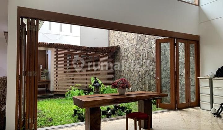 Well-Maintained Spacious House with Front and Central Gardens in Batununggal