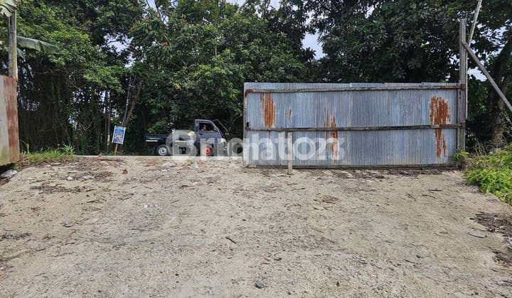 tanah di km 12 pinggir jalan besar cocok untuk investasi