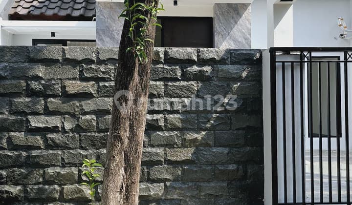 A Citraland house with an attic room, just a stone's throw away to Pakuwon Indah for only 2M.