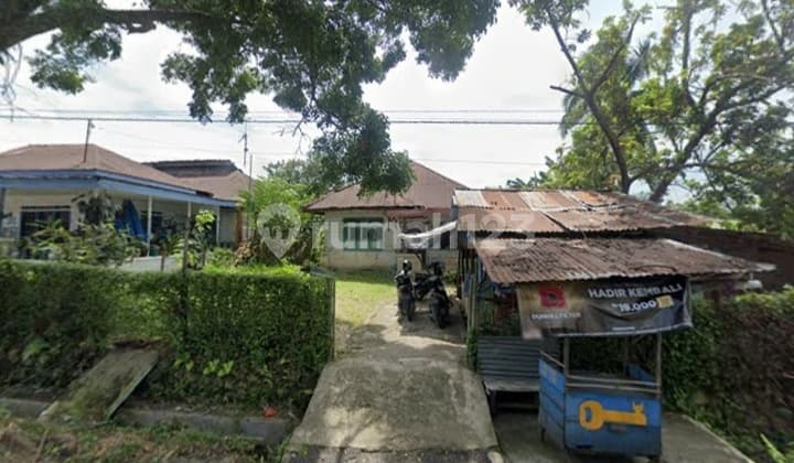 Land and Building with Wide Yard for Sale