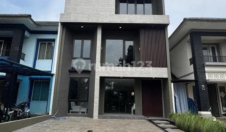 3-story house with 3+1 east-facing rooms in front of a garden in Alam Sutera