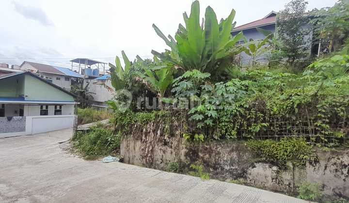 Strategic Land for Sale, Prime Road Front Location, Paved for Housing, Suitable for Boarding Houses and Rentals, Negotiable Price.