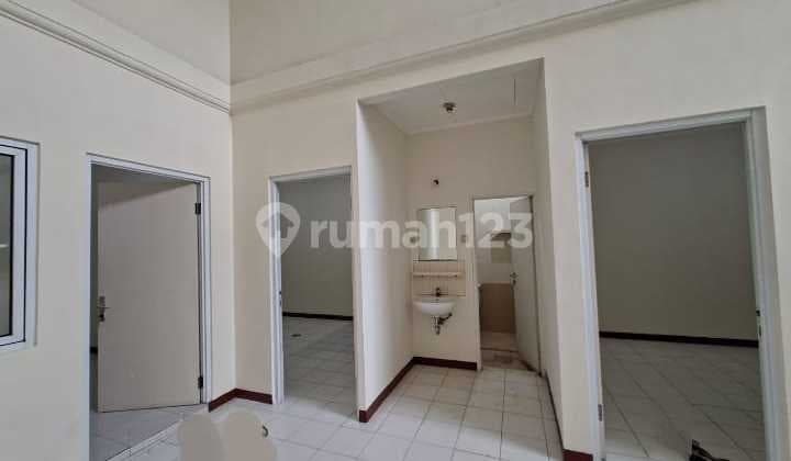 There are 3 ACs, a water heater, and a front road. The house has 3 bedrooms, and it is in neat condition.