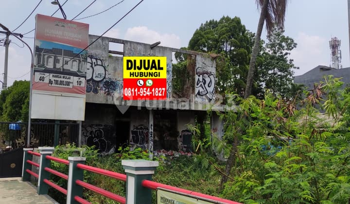 Good Land with Bonus of Damaged Building on Citayam Depok Main Road.