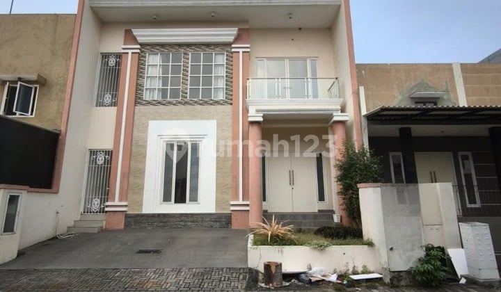 Affordable 2-Story Minimalist Semi-Furnished House Ready to Occupy Near Gwalk in International Village Citraland Utama West Surabaya