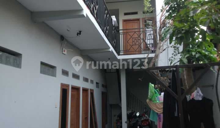 Two-Story Boarding House with 11 Bedrooms and 11 Ensuite Bathrooms.