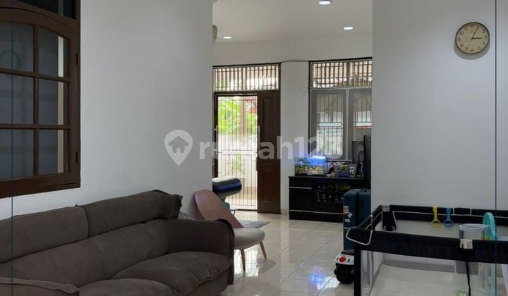 For Sale Cheap - Semi-Furnished Ready-to-Live Strategic Home, Two-Car Road Row, Comfortable Neighborhood & KPR Available in Citra Garden 1, West Jakarta