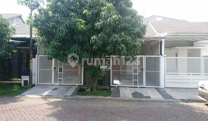 Rumah di Purimas Gununganyar di Jalan Boulevard Selangkah ke Merr