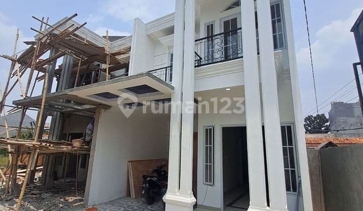 For sale: 2-story house for around 800 million in Kalimulya, Depok.