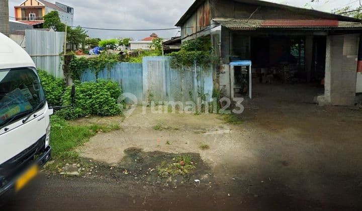 Land for sale on arterial road, suitable for restaurant or workshop business.