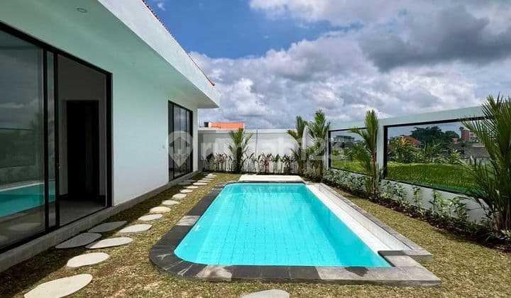 Brand new unfurnished 2 bedroom villa in Berawa with garden space and stunning sunset rice field views