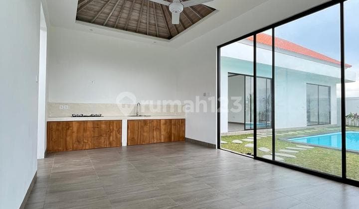 Brand new unfurnished 2 bedroom villa in Berawa with garden space and stunning sunset rice field views