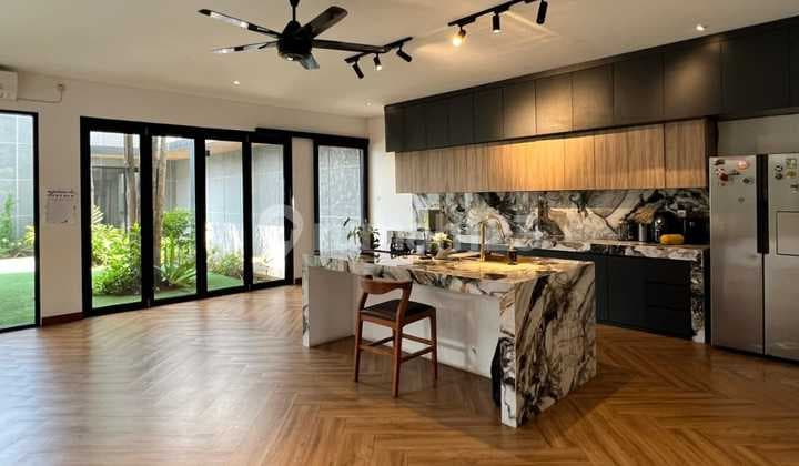Modern Tropical House in Cinere, Features a Fish Pond, Spacious Backyard