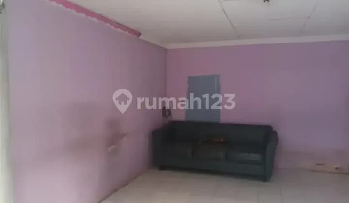 Rent out a former office room with AC as a boarding room.
