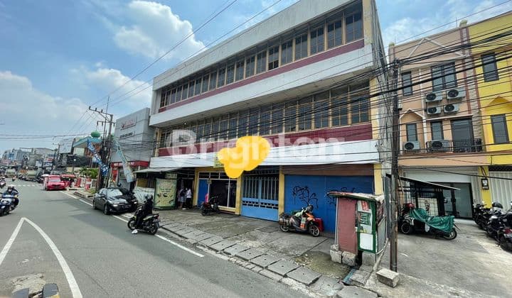 Quick Sale: 3-Storey Building with a bonus house at the back, located at Jl. Arif Rahman Hakim, Beji - Depok City.
