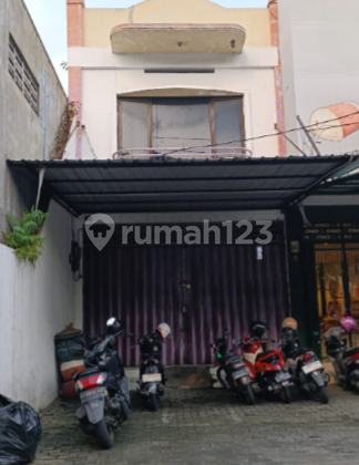 Indonesian property translation: For Rent: Nginden Main Road Shop House, Strategic Location in Commercial Area, Suitable for Office, Pharmacy or Retail