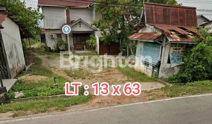 RUMAH DENGAN LAHAN LUAS PINGGIR JALAN RAYA DRPAN RUMAH ADAT MELAYU SINGKAWANG