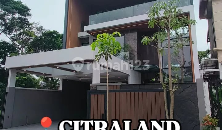 Rumah Baru Premium High End Modern Tropis Kontemporer 3 Lantai Ada Private Lift & Smart Home System di Woodland Citraland Surabaya Barat