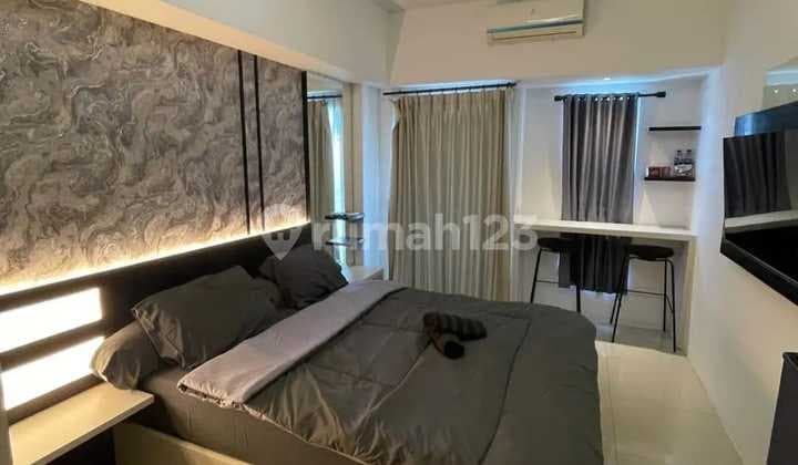 For Rent: Orchard Pakuwon Studio Apartment, 25m², 29th Floor, Furnished, Connected to Pakuwon Mall and a Step Away from Citraland, West Surabaya.