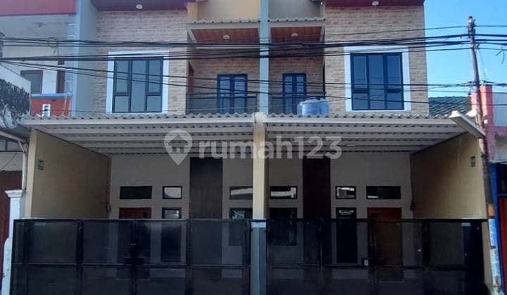 Ready-to-Occupy 2-Story House Ideal for Business, Main Road Location, Eligible for KPR in Harapan Indah City, Bekasi.