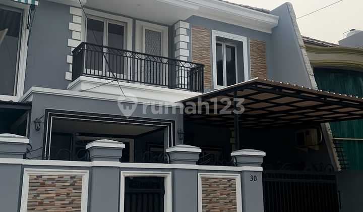 NICE HOUSE CEMPAKA PUTIH LAND 180 BUILDING 240 STRATEGIC LOCATION 2 FLOORS SOUTH PRICE ATTRACTIVE