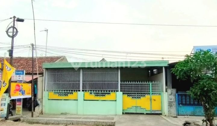 Rumah Di Pinggir Jalan Raya Strategis