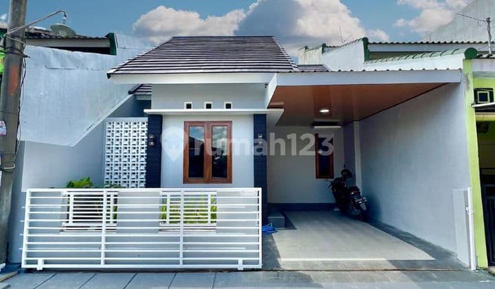 Rumah dalam Perumahan Griya Taman Asri