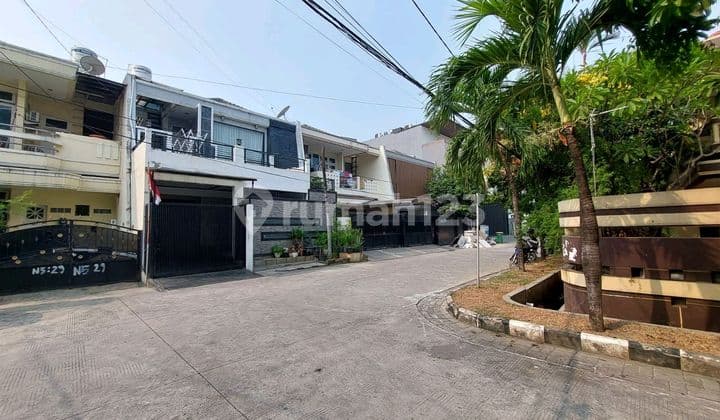 Two-Story Minimalist Cluster House in Green Garden