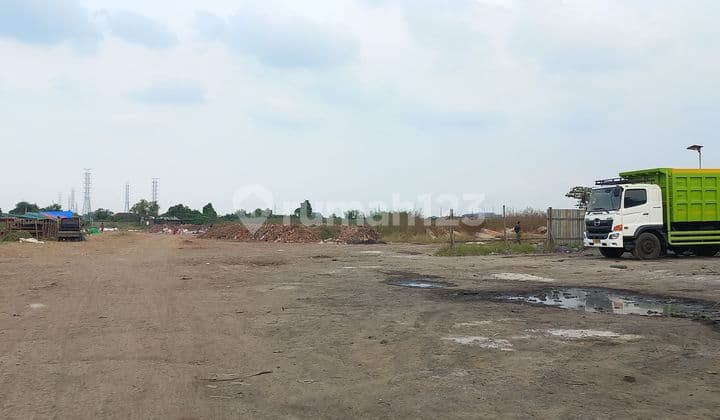 Dijual Tanah lapang dan keras, dengan nilai jual tinggi Di jalan Raya banjir kanal timur Tarumajaya Bekasi
