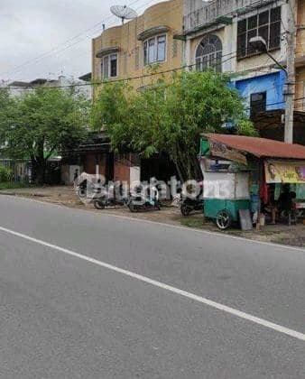 Tanah di Pinggir Jalan Negara / Aksara