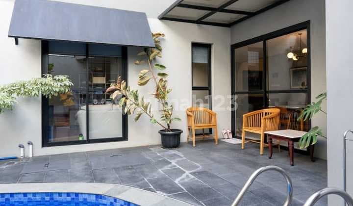 Modern Semi-Industrial House with Swimming Pool. Neat and Ready to Live In, Located in the Favorite Bintaro Sector 9 Complex.